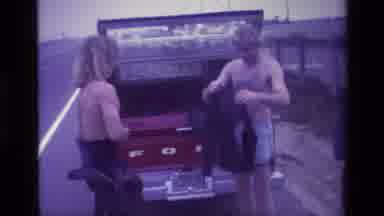 Laguna Beach California USA (1977): Suiting Up For The Adventure Two Men Get Ready