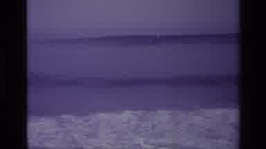 Laguna Beach California USA (1977): A Man Is Scatting Water In The Lakehe Enjoying
