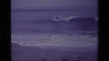 Laguna Beach California USA (1977): Man Surfing Then Camera Switching To Two Men