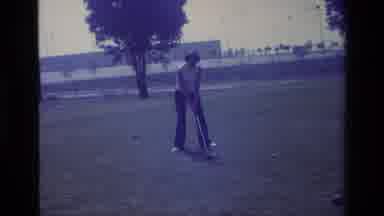 Laguna Beach California USA (1977): Person Lining Up Gold Club To Take A Swing Out
