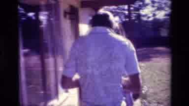 Lake Elsinore California USA (1977): People Outside A Dirty Old Truck Running