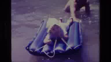Canyon Lake California USA (1978): Baby Floating In The Water With Help Of A