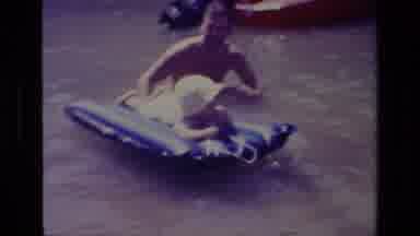 Canyon Lake California USA (1978): Father Plays With His Daughter On A Float On A