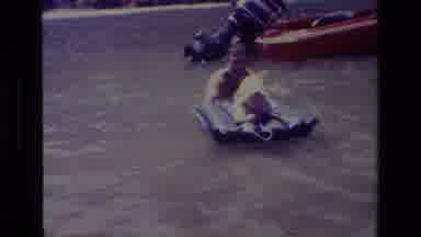 Canyon Lake California USA (1978): Man Playing With Baby On A Lilo Boat With