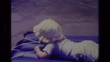 Canyon Lake California USA (1978): Baby In A Bonnet On A Sunny Day Lying On A