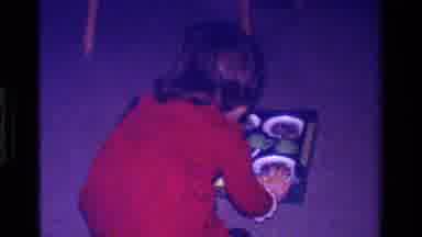 California USA (1979): Young Girl Receives Toy Tea Set And Sets It Up On The Table