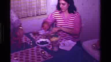 California USA (1979): A Family Of Three Share A Meal Together In A Dining Room