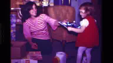 California USA (1979): A Girl Child Is Walking Inside The Room With A Tray