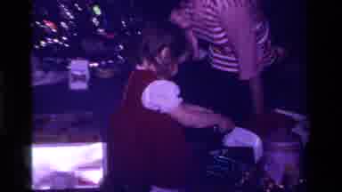 California USA (1979): Little Girl In Red Dress Assembles Toy And Then Passes Out