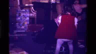 California USA (1979): Child In Red Dress With Parent Opening Gifts On Christmas