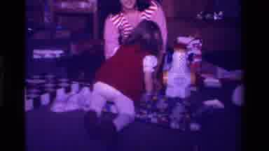 California USA (1979): A Mother Packing A Gift While Her Lovely Little Daughter