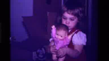 California USA (1979): Child In Home Playing With Toys
