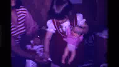 California USA (1979): Little Girl Feeding Her Own Personal Little Baby Doll With