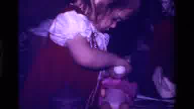 California USA (1979): A Little Girl Feeding Her Beautiful Little Doll With Her