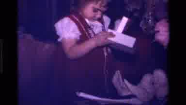 California USA (1979): A Little Girl Opening Up A Christmas Present