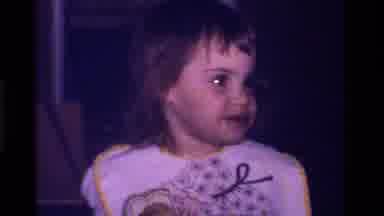 California USA (1979): Toddler Girl Eats Cake At Home