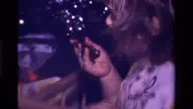California USA (1979): Infant Eating Chocolate Cake With Hands While Standing In