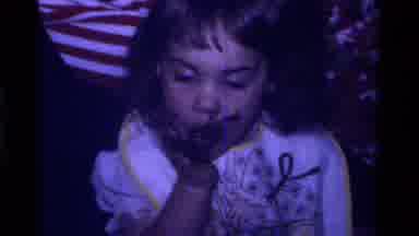California USA (1979): Little Girl With Cake On Her Face Eats Chocolate Cake