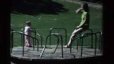 California USA (1979): A Mom And A Small Little Girl In Pink Are Riding Around On