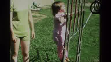 California USA (1979): A Little Girl Playing At The Backyard With Her Mom