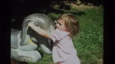 California USA (1979): A Baby Girl Enjoying Her Ride On The Seesaw In The Park