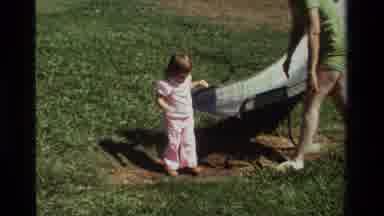 California USA (1979): A Young Mother Teaches Child How To Play On The Slide