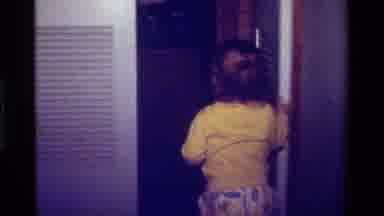 California USA (1979): Toddler Exploring Closet