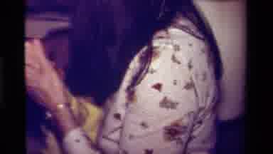 California USA (1979): Adult Woman Walking Carrying Toddler Placed Floor Crying