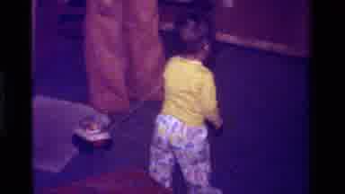California USA (1979): Baby Walking And Flaunting His New Fun Toy To The People