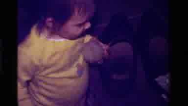 California USA (1979): Little Girl Wearing Yellow Playing With A Baseball And