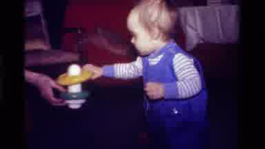 California USA (1979): A Little Kids Plays With A Toy