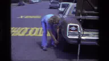 Laguna Beach California USA (1979): Changing Tires On A Late Model Car On The Side
