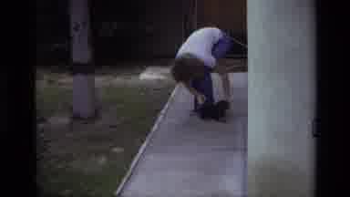 Laguna Beach California USA (1979): Person Playing And Petting Cute Puppy Outside