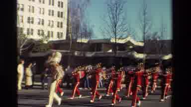 California USA-1981: Drum Major Leads A Red And Gold Marching Band In A Parade