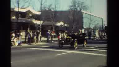 California USA (1981): Parade Including An Old Car Go-Kart And Color Guard With Us