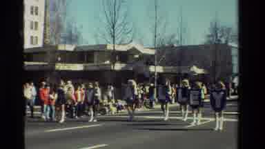 California USA (1981): A Band In Blue Uniforms Marching In A Parade With Girls