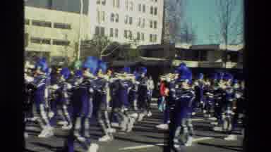 California USA (1981): Parade With Marching Band In Blue Uniforms And A Group Of