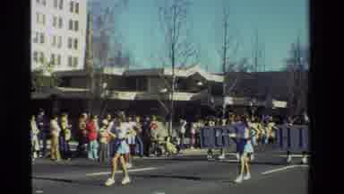 California USA (1981): A Throwback Band Marches In A Parade Followed By A Classic