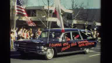California USA (1981): People Standing Watching A Parade With A Car With Red