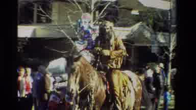 California USA (1981): Small Town Parade With Indians And Cars Full Of People
