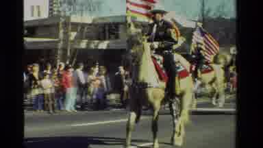 California USA (1981): Cowboy Walks Tamed Camels During Parade