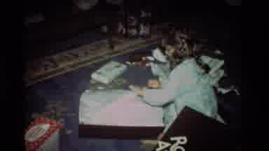 California USA (1981): Young Girl Opening Her Pink Winter Coat On Christmas Day