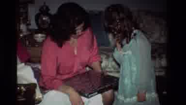 California USA (1981): A Woman And A Child With A Box That Seems To Be A Toy
