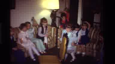 California USA (1981): Well Dressed Girls At A Party Playing A Game On A Chair And