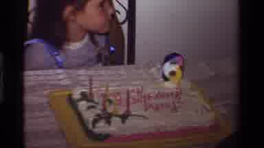 California USA (1981): Little Girl Celebrating Birthday At Home With Cake And