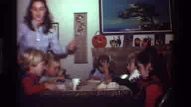 California USA (1981): Mother Serving Children Drinks And Food At Their Own Table