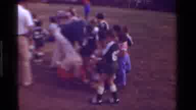 California USA (1981): A Children's Sports Team Gathered Together While A Lady