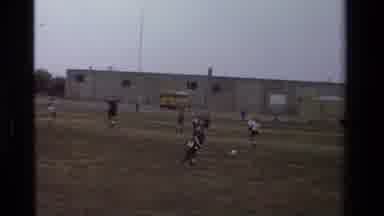 California USA (1981): Two Little Soccer Players Go For Ball And Take Each Other