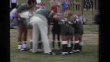 California USA (1981): Childs Team In A Huddle With Manager Before A Sports Game