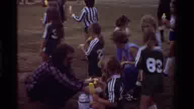California USA (1981): Woman Handing Out Drinks To Girl Soccer Team Man Rubbing